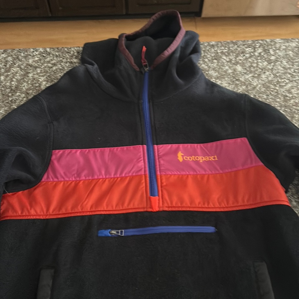 Never worn Cotapaxi hooded fleece.